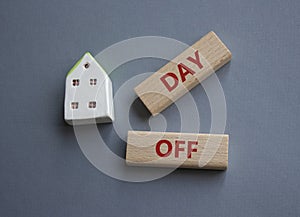 Day off symbol. Concept word Day off on wooden blocks. Beautiful grey background. Business and Day off concept. Copy space