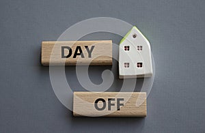 Day off symbol. Concept word Day off on wooden blocks. Beautiful grey background. Business and Day off concept. Copy space