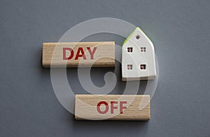 Day off symbol. Concept word Day off on wooden blocks. Beautiful grey background. Business and Day off concept. Copy space