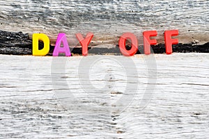 DAY OFF words on wood background