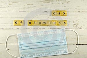 day of slowness.words from wooden cubes with letters