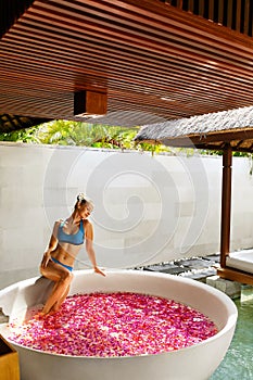 Day Spa Body Care. Woman Relaxing Near Flower Bath Outdoors