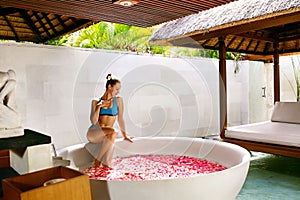 Day Spa Body Care. Woman Relaxing Near Flower Bath Outdoors