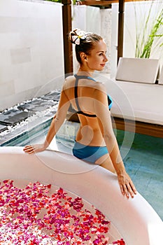 Day Spa Body Care. Woman Relaxing Near Flower Bath Outdoors