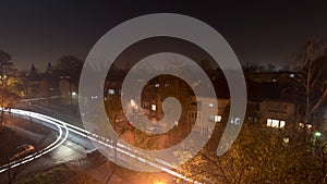 Day to night time lapse of foggy winter day in small suburbs area near Belgrade