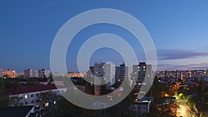 Day to night timelapse of Eastern Europe apartment buildings and city lights