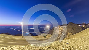 Day to night timelapse with rocks from Jebel Hafeetwith impressive view over the city.