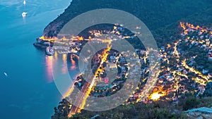 Day to night timelapse view of the Mediterranean coastline of the town of Eze village on the French Riviera