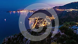 Day to night timelapse view of the Mediterranean coastline of the town of Eze village on the French Riviera