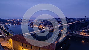 Day to Night view of the historic city of Porto, Portugal timelapse with the Dom Luiz bridge