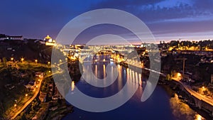 Day to night view of the historic city of Porto, Portugal timelapse with the Dom Luiz bridge