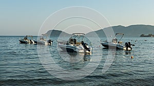 day trip motor boats anchored in bay of Zakynthos island, Greece, August 2023