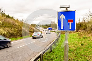 Day view background of UK Motorway Road Sign photo