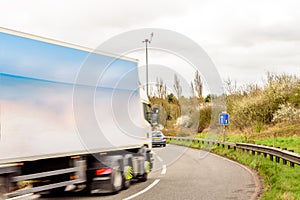 Day view background of UK Motorway Road Sign Lorry Truck