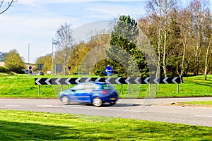 Day view of busy traffic on UK Motorway roundabout