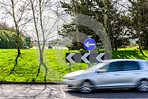 Day view of busy traffic on UK Motorway roundabout
