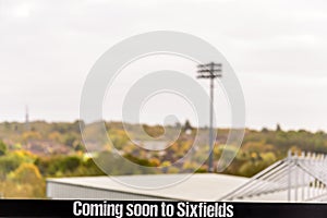 Day View of Coming Soon In Sixfields Sign Over Northampton Cobblers Football Stadium