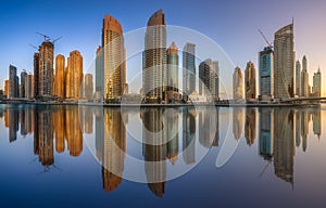 Day view of Dubai Marina bay with clear sky, UAE