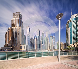 Day view of Dubai Marina bay with clear sky, UAE