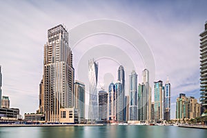 Day view of Dubai Marina bay with clear sky, UAE