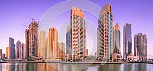 Day view of Dubai Marina bay with clear sky, UAE