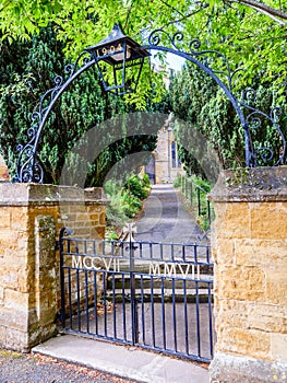 Day view entrance gates to typical Old English Church building