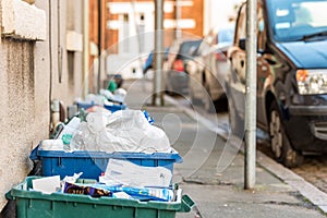 Day view plastice waste refuse bins boxes on British road