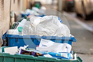 Day view plastice waste refuse bins boxes on British road