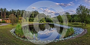 Day view of the pond in the city park