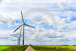 Day view wind power turbines generate electricity