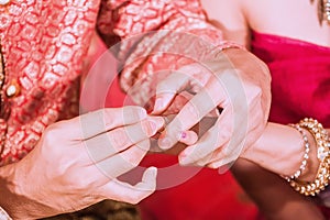 On the day of the wedding, the newlyweds have to be pushed aside by exchanging sweet ring to it.