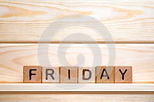 Day of the week. Friday made from vintage wooden cubes. Last working day. Calendar background. Week day concept. Working