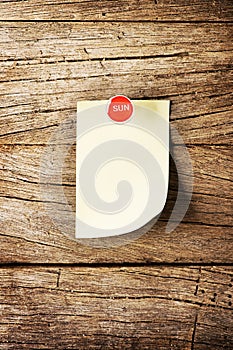 Day of week Sticky note with pin over wooden background