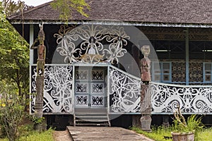 Dayak Experience Center Kutai Kartanegara, a Dayak tribal house with beautiful carvings typical of the Dayak tribe.