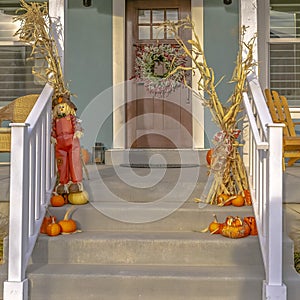 Daybreak home with stairs balcony and brown door