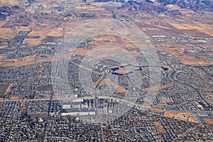 Daybreak Lake and Community and Oquirrh Mountains aerial, Copper Mine, Wasatch Front Rocky Mountains from airplane during fall. So