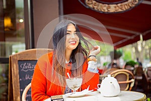 Daydream in coffee shop. Portrait young Indian asian businesswoman smiling touching hair looking away waiting for boyfriend friend