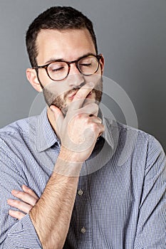 Daydreaming 30s bearded man closing his eyes thinking and relaxing