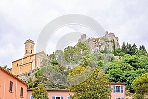 Daylight foggy view to Eze, Cote d`Azur village with medieval ho