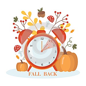Daylight saving time concept.Alarm clock on the autumn leaves and pumpkins background. The reminder text - set clock back one