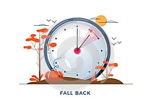 Daylight Saving Time concept. Autumn landscape with text Fall Back, the hand of the clocks turning to winter time. DST photo