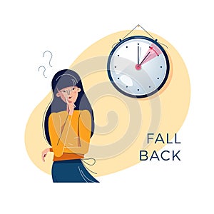 Daylight Saving Time. Confused woman is looking at the clock. Winter time concept. Text fall back. The hand of clocks