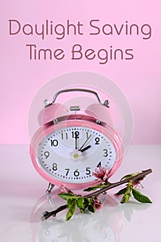 Daylight savings time begins clock concept for start at Spring with text photo