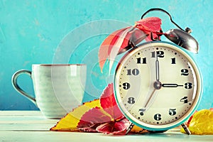 Daylight Savings Time concept, fall back in autumn. A retro alarm clock