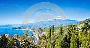 Daylight view of Taormina and beach of Giardini-Naxos located in Metropolitan City of Messina, on east coast of Sicily island,