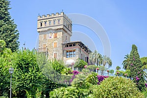 Daylight view to Rapallo castle with green trees