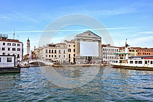 Daylight view from water to Riva degli Schiavoni waterfront buildings and bridge