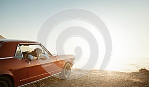 Days by the sea are all I need. a young woman enjoying a road trip along the coast.