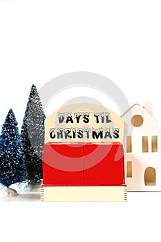 Days til Christmas vintage style wood calendar on white background. photo