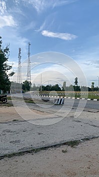 daytime in the district capital with a beaground of two network transmitters